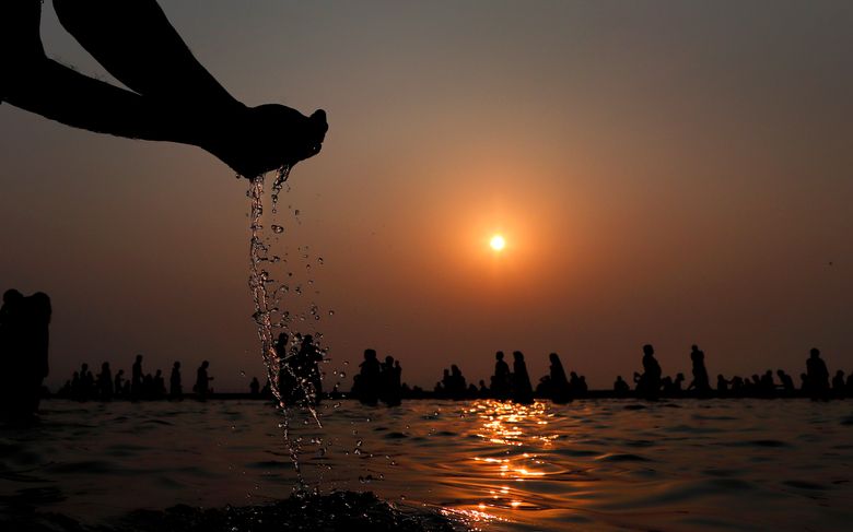 Holy bathing at Triveni Sangam
